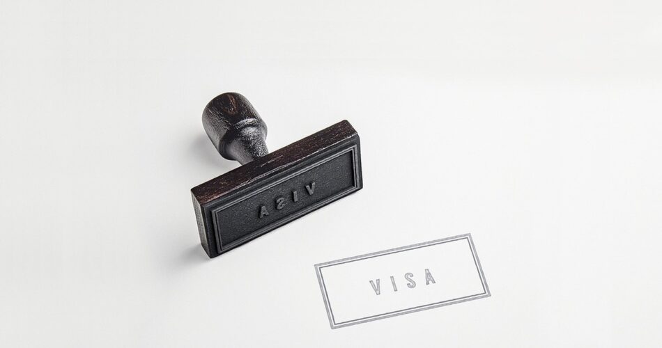 A rubber stamp marking a visa page in a passport
